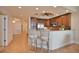 Kitchen island with seating, stainless steel appliances, and granite counters at 6360 Watercrest Way # 203, Lakewood Ranch, FL 34202
