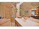 Modern bathroom with a walk-in shower and double vanity at 6360 Watercrest Way # 203, Lakewood Ranch, FL 34202