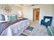 Spacious bedroom with plush seating and ensuite bath access at 6360 Watercrest Way # 203, Lakewood Ranch, FL 34202