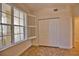 Bedroom with large window, shutters, and double doors at 6360 Watercrest Way # 203, Lakewood Ranch, FL 34202
