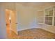 Bedroom with window, door to hallway, and tiled floors at 6360 Watercrest Way # 203, Lakewood Ranch, FL 34202