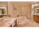 Luxurious bathroom with a large soaking tub and walk-in shower at 6360 Watercrest Way # 203, Lakewood Ranch, FL 34202