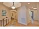 Spacious foyer with tile flooring, bench seating, and access to other rooms at 6360 Watercrest Way # 203, Lakewood Ranch, FL 34202
