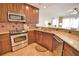 Updated kitchen with stainless steel appliances and granite countertops at 6360 Watercrest Way # 203, Lakewood Ranch, FL 34202