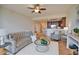 Open living room with access to kitchen and balcony at 6360 Watercrest Way # 203, Lakewood Ranch, FL 34202