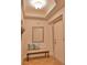 Light and airy entryway with tiled floors, a bench, and mirror at 6360 Watercrest Way # 203, Lakewood Ranch, FL 34202