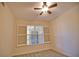 Well-lit bedroom with window shutters and neutral carpeting at 6360 Watercrest Way # 203, Lakewood Ranch, FL 34202
