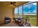 Enjoy breathtaking lake and golf course views from this screened balcony at 6360 Watercrest Way # 203, Lakewood Ranch, FL 34202