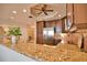 Granite countertop kitchen island with stainless steel appliances at 6360 Watercrest Way # 203, Lakewood Ranch, FL 34202