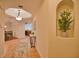 Bright entry hall with tile flooring, bench seating, and views to the dining and living areas at 6360 Watercrest Way # 203, Lakewood Ranch, FL 34202