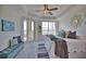 Main bedroom with water views and comfortable sitting area at 6360 Watercrest Way # 203, Lakewood Ranch, FL 34202