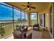 Spacious screened balcony overlooking a golf course and lake at 6360 Watercrest Way # 203, Lakewood Ranch, FL 34202