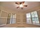 Bedroom with large window and plantation shutters at 6360 Watercrest Way # 203, Lakewood Ranch, FL 34202