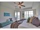 Main bedroom with water views and a cozy sitting area at 6360 Watercrest Way # 203, Lakewood Ranch, FL 34202
