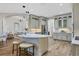 Modern kitchen with white cabinets, marble island, and stainless steel appliances at 2197 Nita Ter, North Port, FL 34286