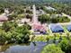 Aerial view of single-Gathering home with canal, lush landscaping, and neighboring houses at 2197 Nita Ter, North Port, FL 34286