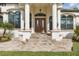 Elegant home exterior with columns, stone walkway, and double doors at 2197 Nita Ter, North Port, FL 34286