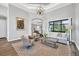 Open living area with hardwood floors, neutral decor, and large windows at 2197 Nita Ter, North Port, FL 34286