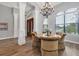 Formal dining area with round table and elegant chairs near the entryway at 2197 Nita Ter, North Port, FL 34286