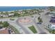 Aerial view of a beachside roundabout with parking and ocean views at 2197 Nita Ter, North Port, FL 34286