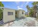 Side yard patio with table and chairs, great for outdoor dining at 603 Locarno Dr, Venice, FL 34285