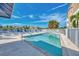 Community pool with lounge chairs and waterfront views at 1960 Oregon Trl # 3D, Englewood, FL 34224