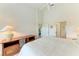 Comfortable bedroom with king-size bed and ensuite bathroom at 872 Saranac Lake Dr # 202, Venice, FL 34292