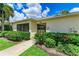 Community building with screened porch and landscaping at 872 Saranac Lake Dr # 202, Venice, FL 34292