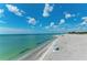 Stunning aerial view of a secluded beach with turquoise water at 872 Saranac Lake Dr # 202, Venice, FL 34292