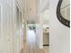 Light-filled hallway with access to other rooms at 872 Saranac Lake Dr # 202, Venice, FL 34292