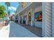Several shops on a sidewalk with unique designs and outdoor seating at 872 Saranac Lake Dr # 202, Venice, FL 34292