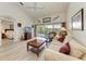 Living room with comfy sofa and access to balcony at 872 Saranac Lake Dr # 202, Venice, FL 34292