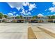 Community parking area with covered carport and guest parking at 872 Saranac Lake Dr # 202, Venice, FL 34292