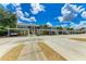Community parking with covered parking and landscaping at 872 Saranac Lake Dr # 202, Venice, FL 34292