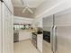 Modern kitchen with stainless steel appliances and ample counter space at 872 Saranac Lake Dr # 202, Venice, FL 34292