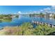 Scenic waterway view with lush vegetation and waterfront homes at 872 Saranac Lake Dr # 202, Venice, FL 34292