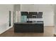 Modern kitchen with sleek cabinetry, large island, and stainless steel appliances at 15060 Aquarius Cir, Port Charlotte, FL 33981