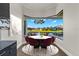 Elegant dining area with water views and modern chandelier at 15060 Aquarius Cir, Port Charlotte, FL 33981