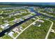 Aerial view of waterfront community with many homes at 15060 Aquarius Cir, Port Charlotte, FL 33981