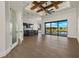 Open living space with water views, wood beams, and modern furniture at 15060 Aquarius Cir, Port Charlotte, FL 33981