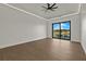 Bright and airy bedroom with water views and ceiling fan at 15060 Aquarius Cir, Port Charlotte, FL 33981
