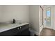 Clean bathroom with gray vanity, marble countertop, and walk-in shower at 15060 Aquarius Cir, Port Charlotte, FL 33981
