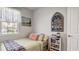 Bright bedroom with a window and built-in shelving at 248 Ibiza Loop, Venice, FL 34292