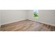 Bright bedroom featuring wood-look flooring at 2443 Penguin Ln, North Port, FL 34286