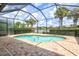 Enclosed pool area with brick pavers and lake view at 13870 Lido St, Venice, FL 34293