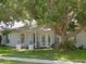 Charming single story home with a tree-lined front yard at 2961 Valencia Rd, Venice, FL 34293