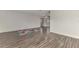 Bright living room featuring hardwood floors and a large window at 5076 Kingsley Rd, North Port, FL 34287