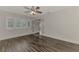 Bedroom with wood-look floors and French doors to patio at 5076 Kingsley Rd, North Port, FL 34287