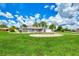 House with a nicely landscaped front yard and circular driveway at 5076 Kingsley Rd, North Port, FL 34287