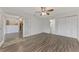 Bright bedroom with wood-look floors and access to the bathroom at 5076 Kingsley Rd, North Port, FL 34287